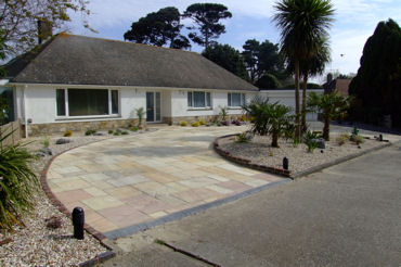 garden design Grand sandstone in and out driveway perhaps Spanish in style with yuccas cordylines,phormium and grasses.374