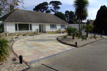garden design Grand sandstone in and out driveway perhaps Spanish in style with yuccas cordylines,phormium and grasses.374
